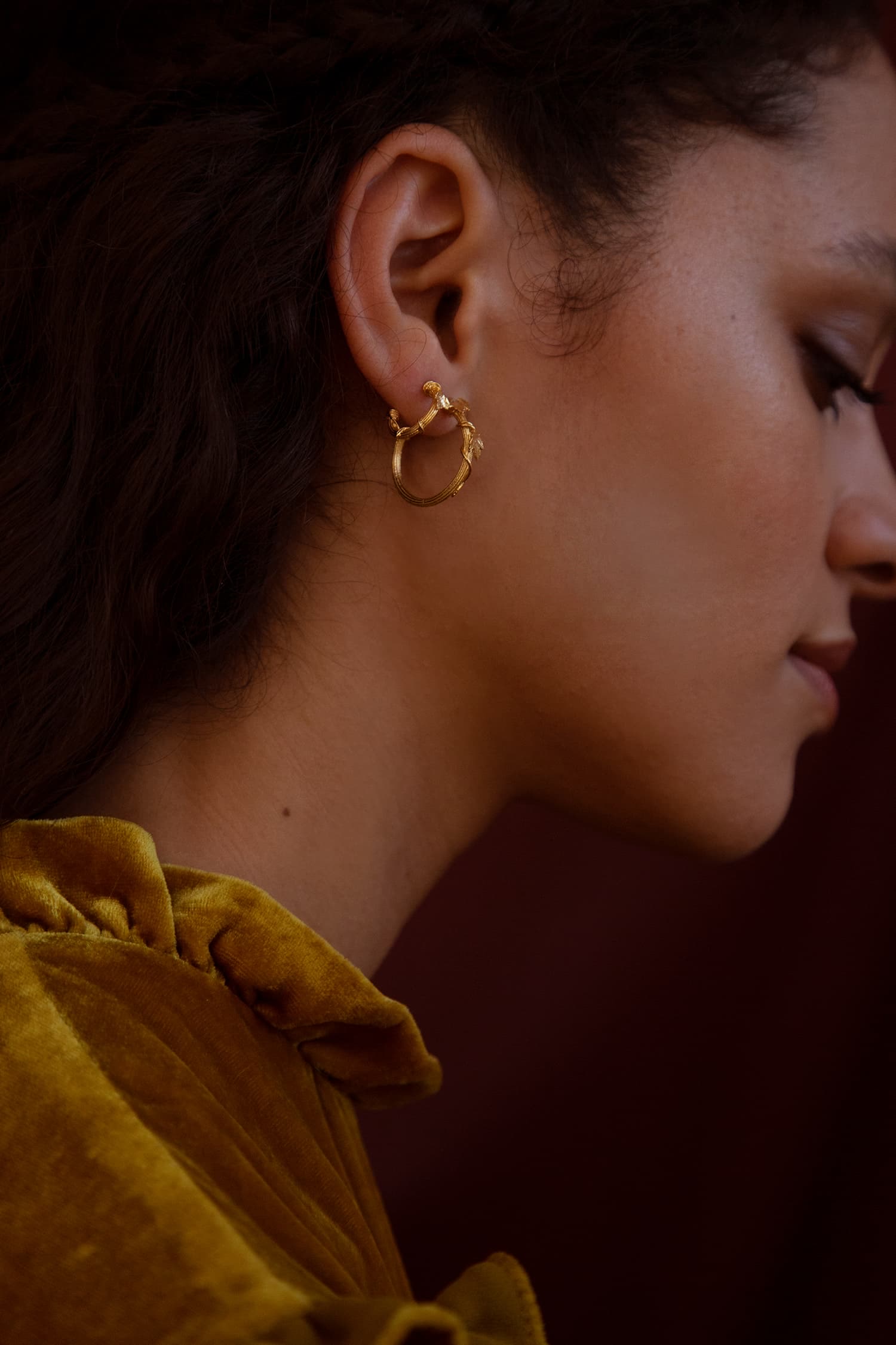 Model wears Fables Overgrown Column hoop earring and mini hoop earring