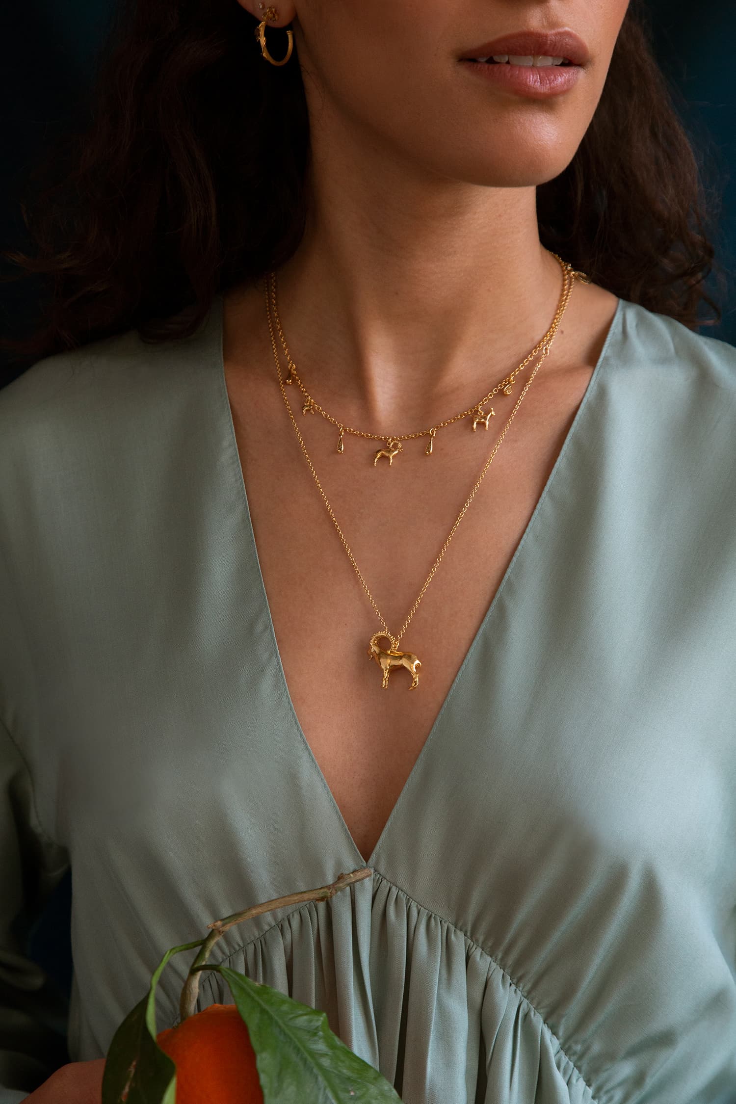 Model wears Fables Hinged Column Bracelet in silver and gold plate with overgrown vine ring and fine gold bands