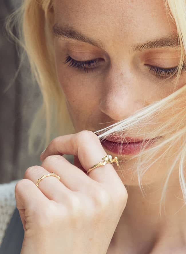 mr and mrs bird pearl nest ring worn by model