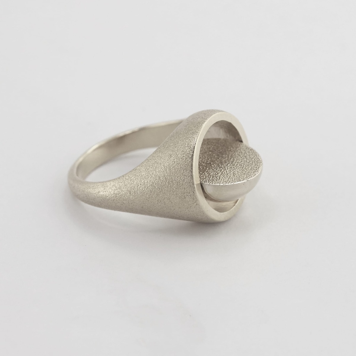 Paper shot of Medi Spinning Dome Signet Ring by Alex Monroe Jewelley