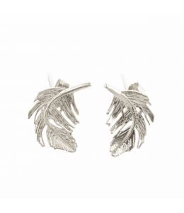 Silver Feather Stud Earrings on Paper