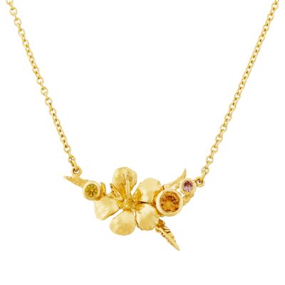 A tropical flower sits inline with rainforest ferns and pops of colourful sapphires cut by Sunrise Facets. Product Photo