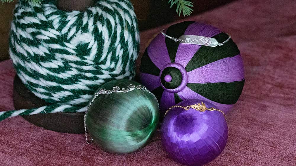 In-line bracelets displayed on festive baubles