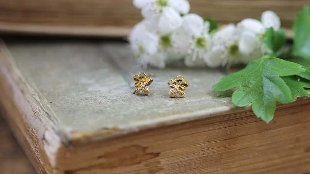 Woman wearing Damselfly earrings.