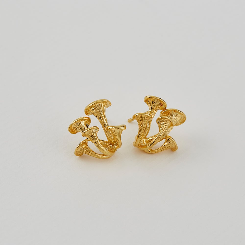 Paper shot of gold plated Clustered Mushroom Earrings by Alex Monroe