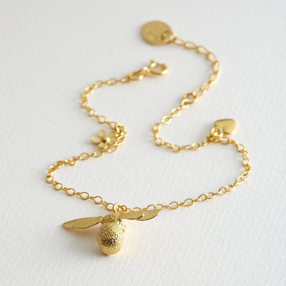Paper shot of Gold Plated Baby bee bracelet by Alex Monroe Jewellery
