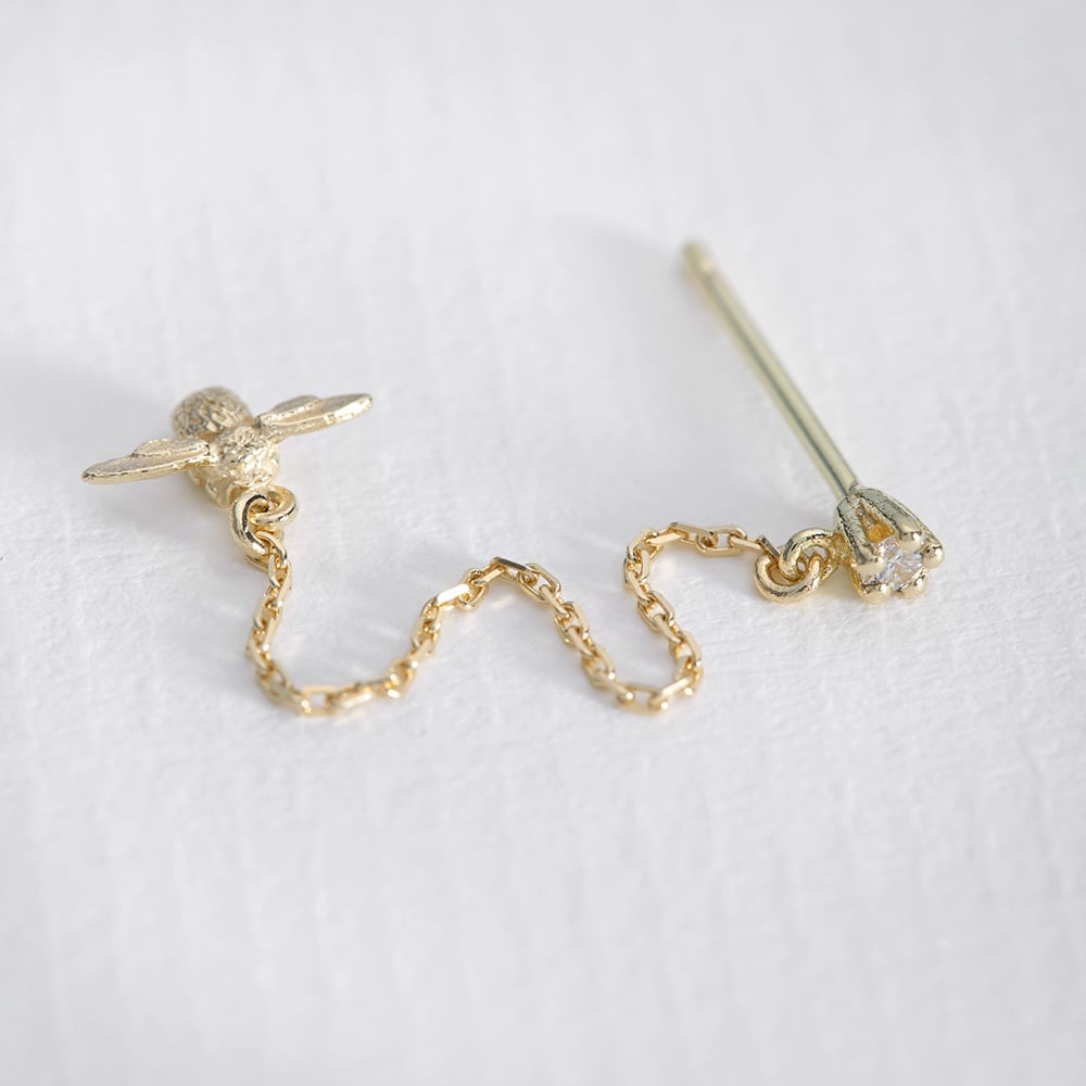 paper shot of Diamond Stud Earrings with Fine Chain Bee Drops by Alex Monroe Jewellery