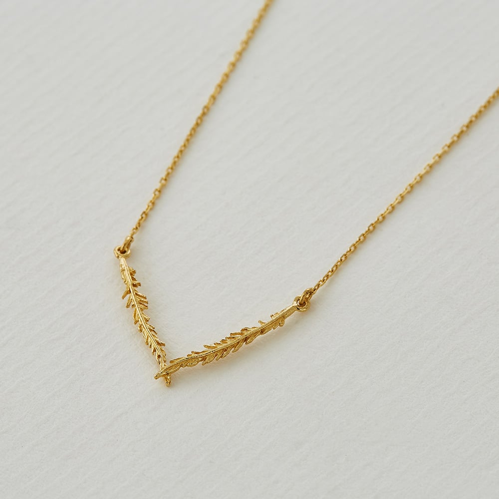 Paper shot of 18ct gold Plume Flare Necklace by Alex Monroe Jewellery