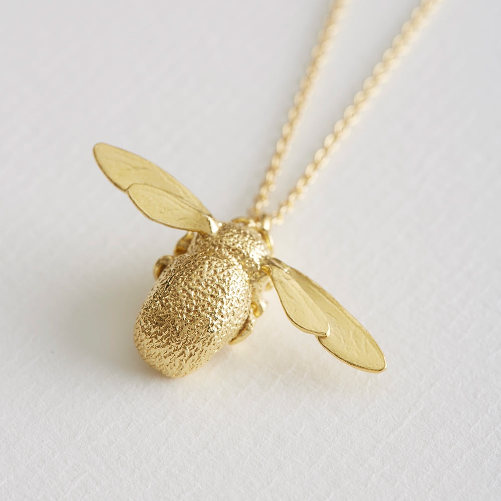 Paper shot of Alex Monroe's Iconic Bumblebee Necklace in gold plate