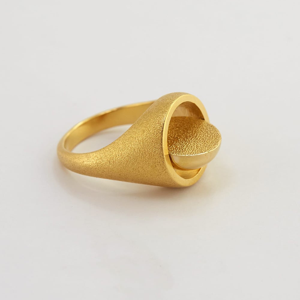 Paper shot of Gold plated Medi Spinning Dome Signet Ring