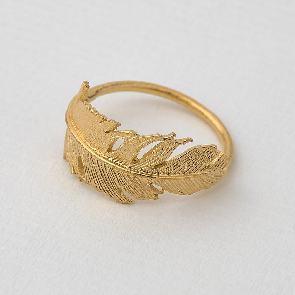 Paper shot of gold plated Wrapped Feather Ring by Alex Monroe Jewellery