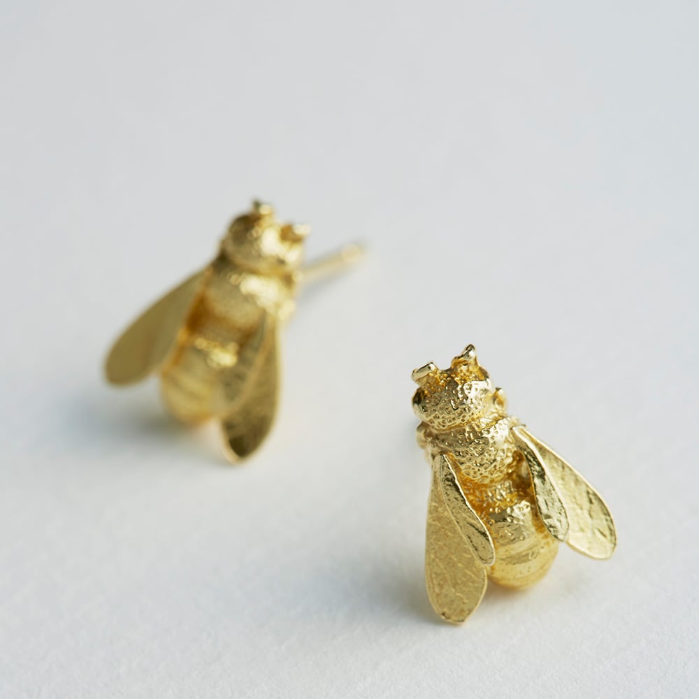paper shot of gold plated Large Honey Bee Studs by Alex Monroe Jewellery