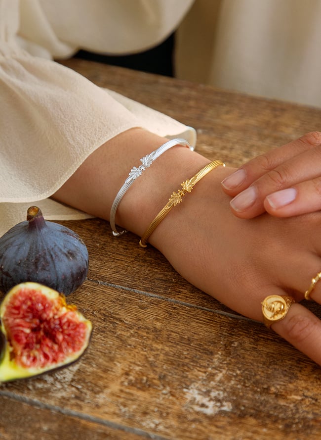 gold plated moth bracelet worn by model