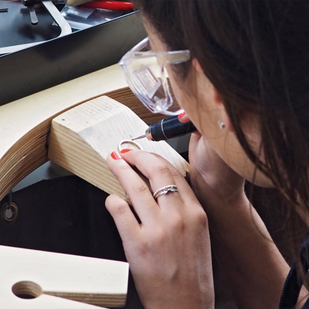 Student working on oceans loop necklace at Alex Monroe's Jewellery school class
