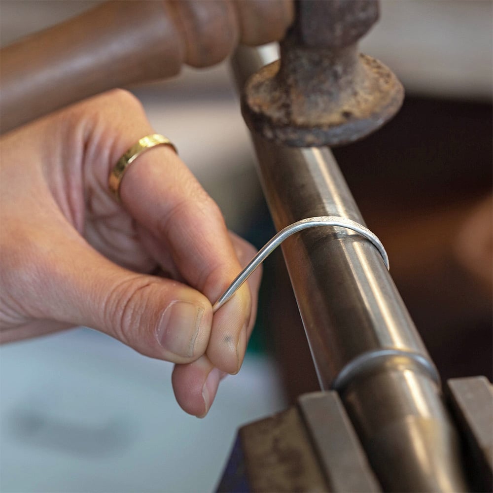 Alex Monroe Jewellery school making a stacking ring with a hammer