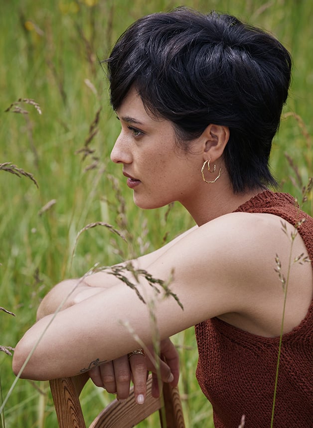 Model wearing Alex Monroe's New Fine Collection Golden Harvest Fine and Large Wild Grass Hoop Earrings