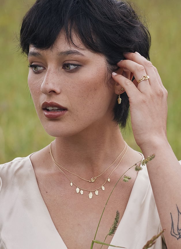 Model wearing Alex Monroe's Woodland Grass Necklace with 7 drops by Golden Harvest