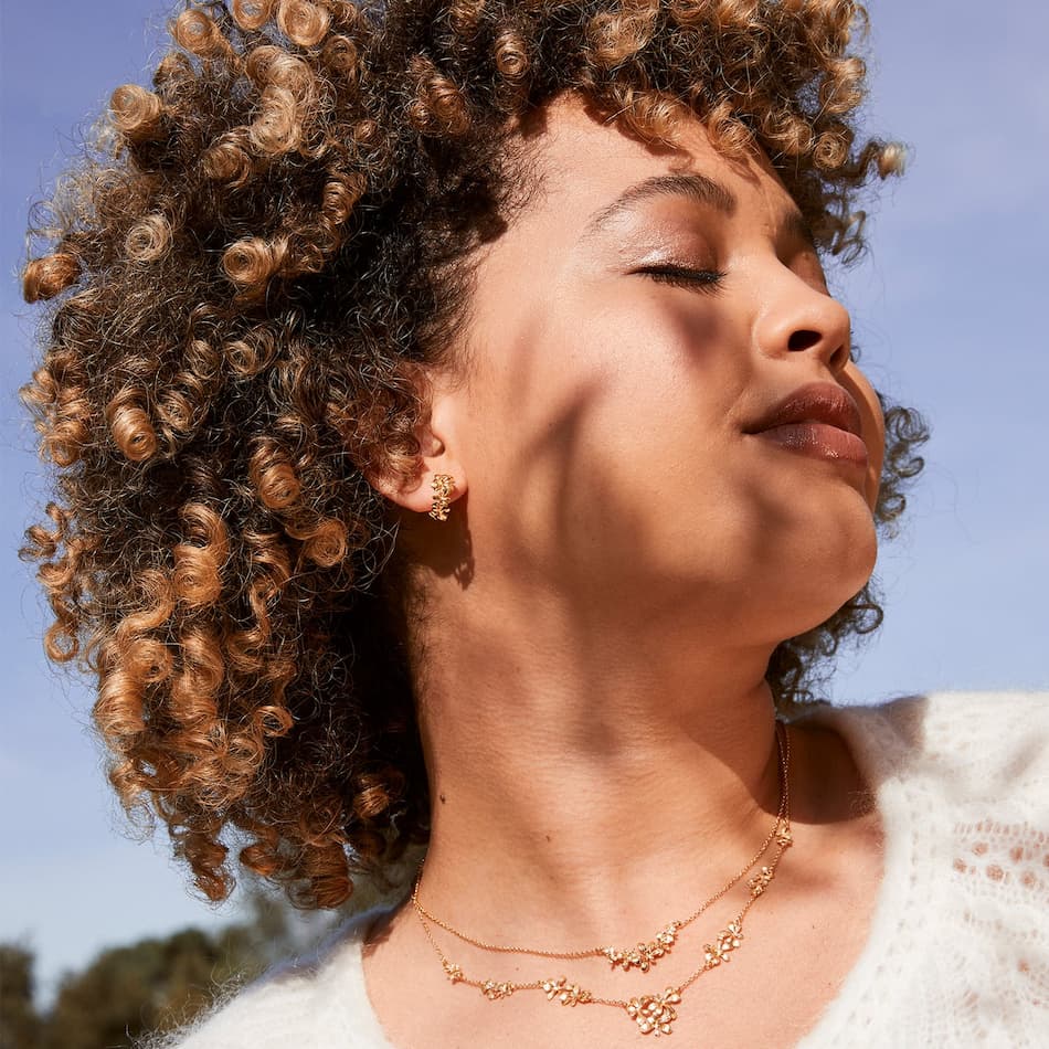 model wearing alex monroe clustered rosette flourish collar necklace