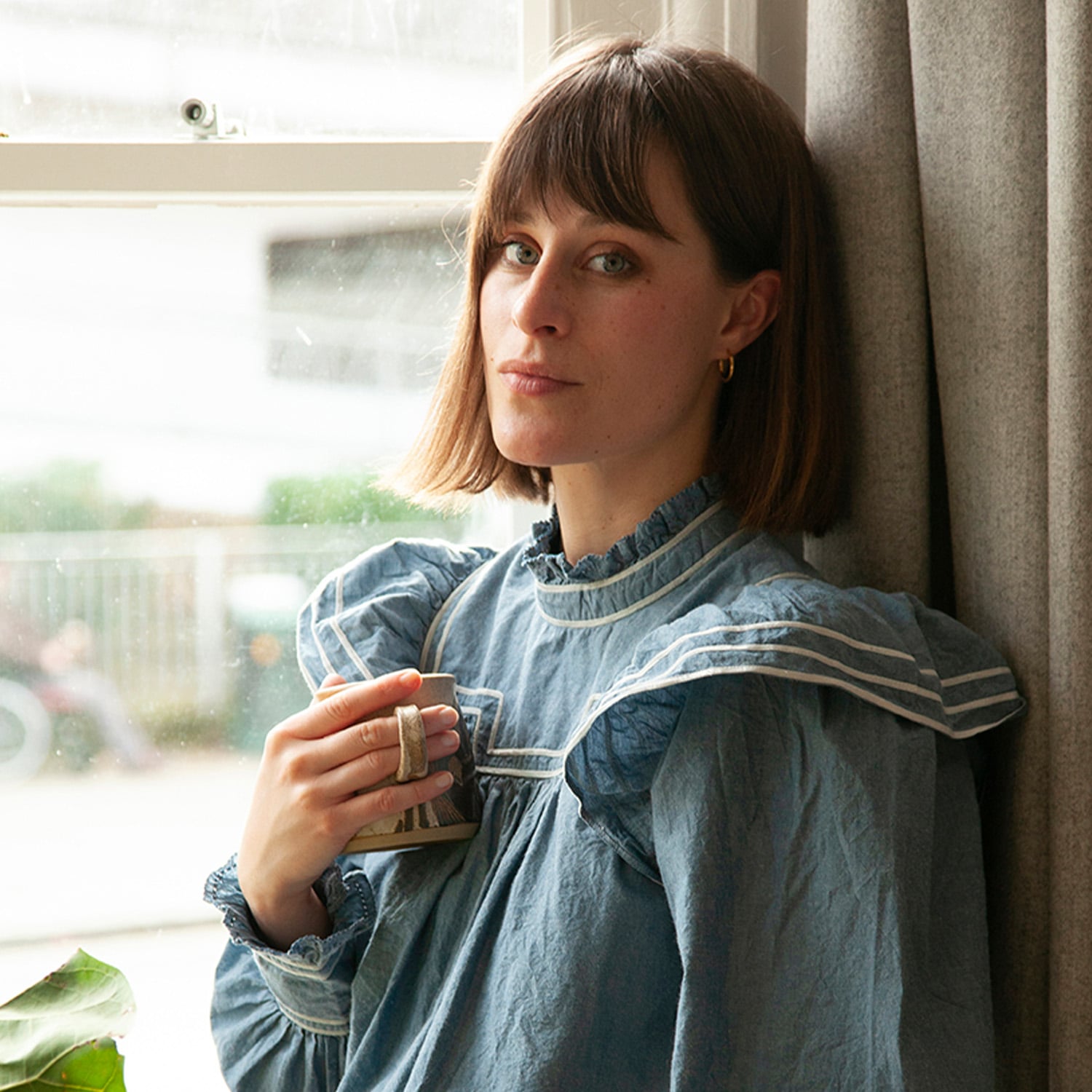 Alice Vincent wearing a blue denim shirt