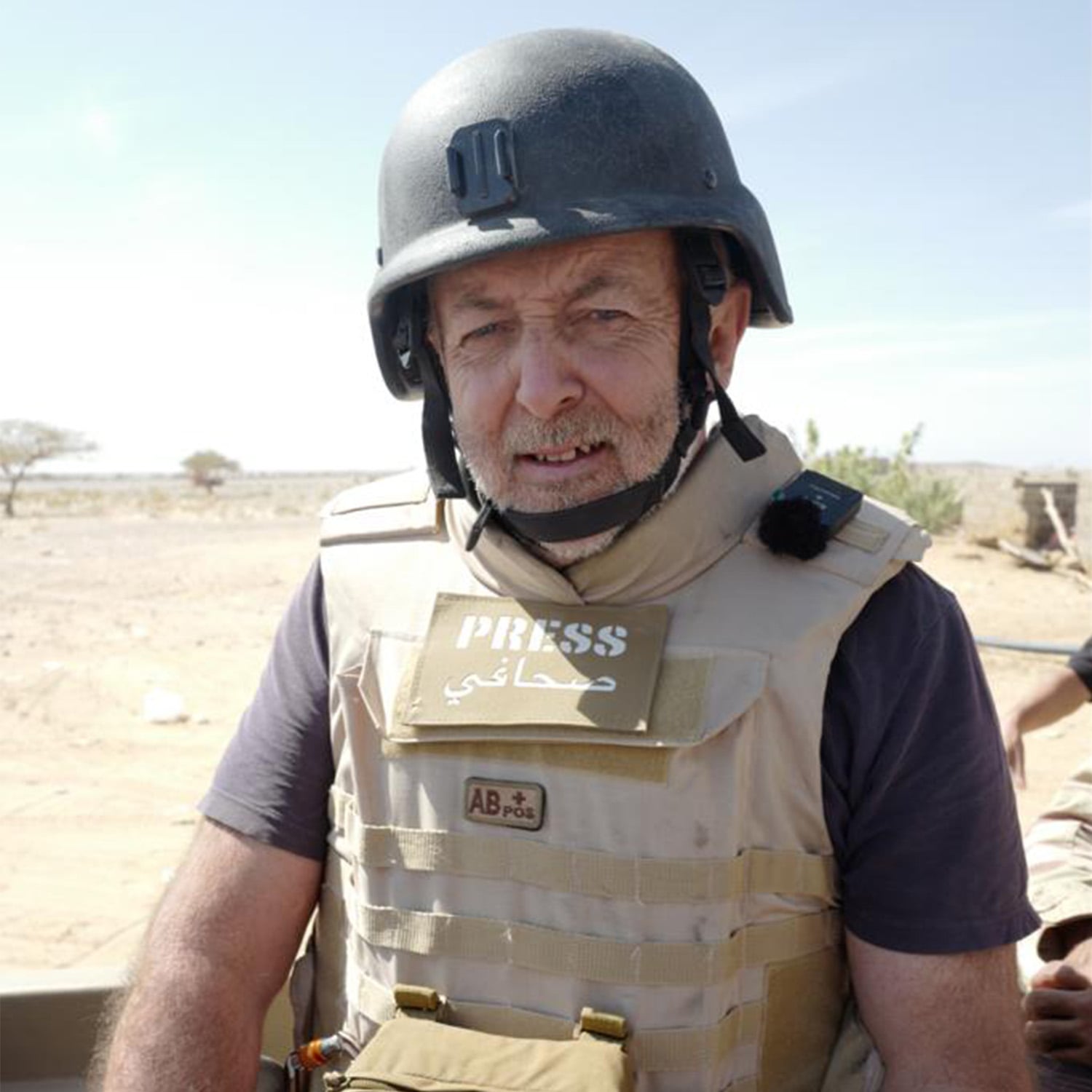 Portrait of Jeremy Bowen in press war gear