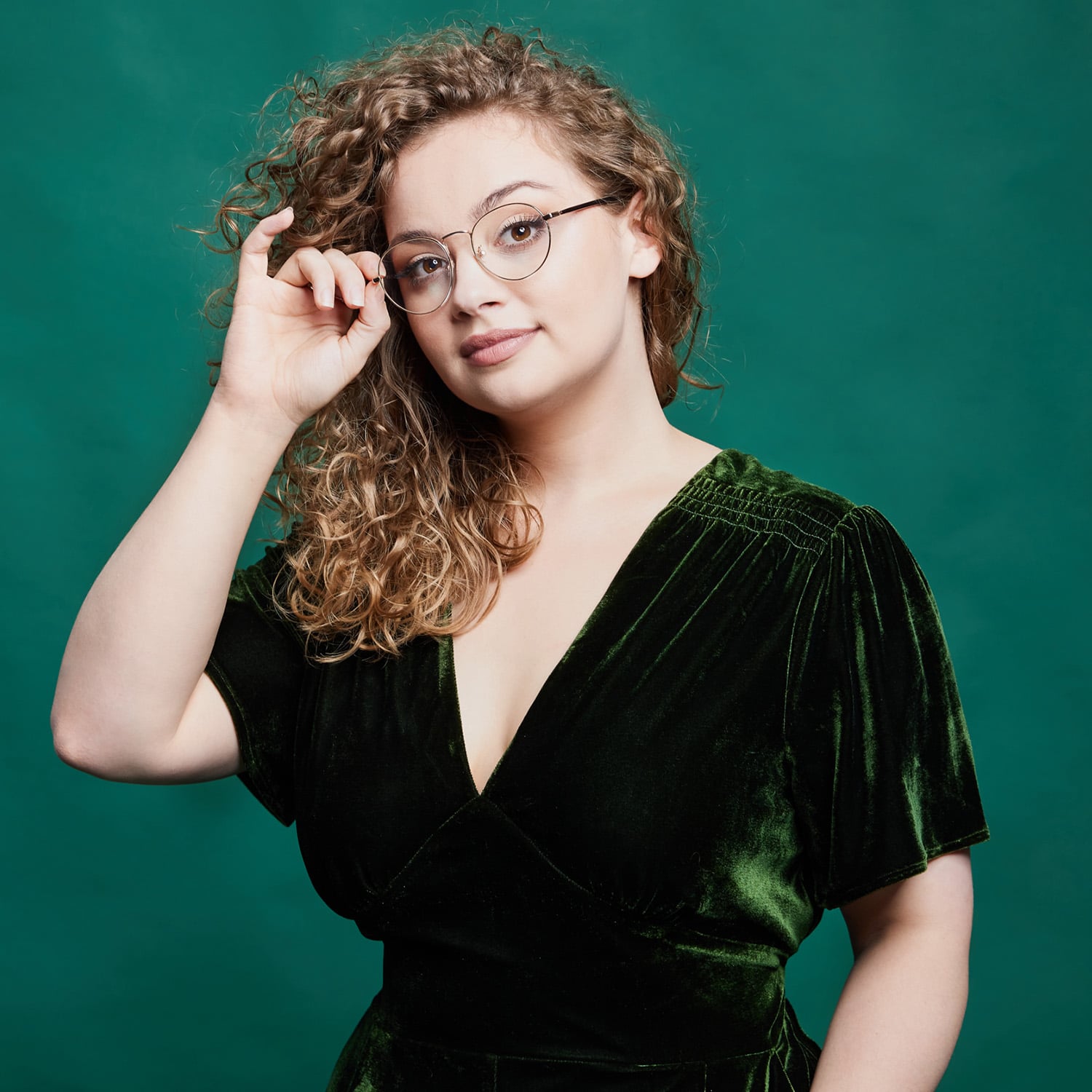 Carrie Hope Fletcher wearing a velvet emerald green dress