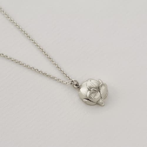 paper shot of silver Artichoke Necklace with Engraved Heart by Alex Monroe Jewellery