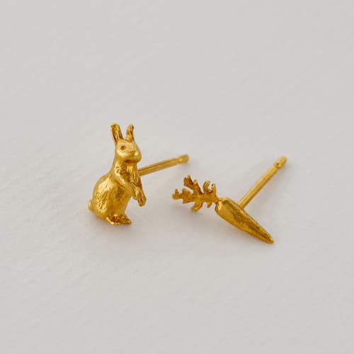 paper shot of gold plated Rabbit Carrot Asymmetric Earrings by Alex Monroe Jewellery