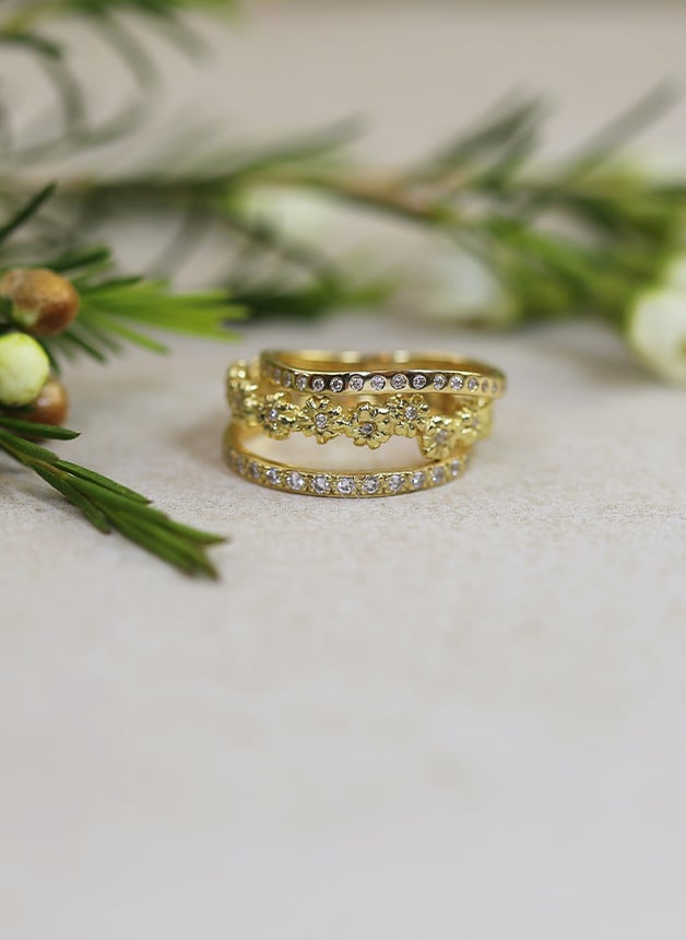 Alex Monroe wedding Diamond bands Seruni Diamond Eternity Ring and Diamond Wave Eternity Band stacked together