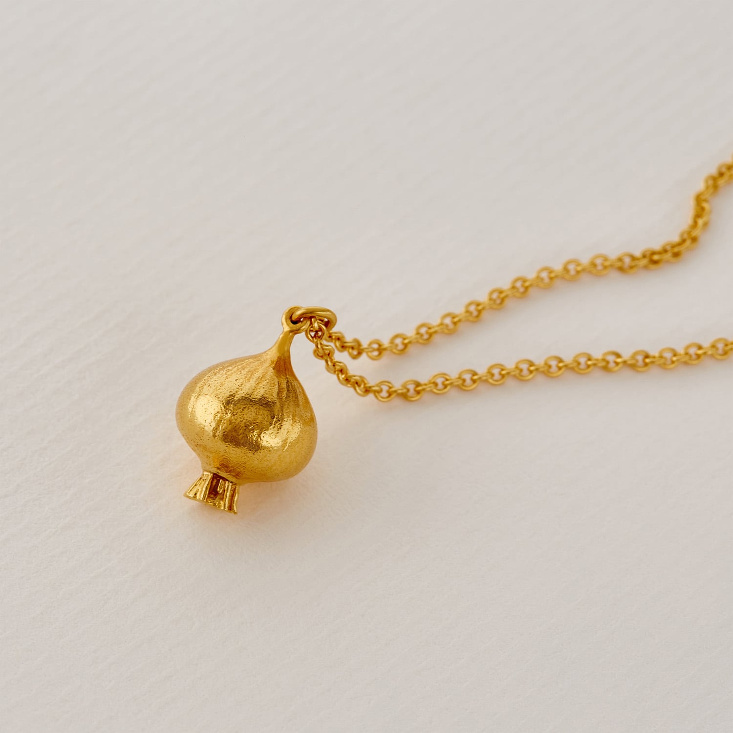 paper shot of gold plated Know Your Onions Cluster Necklace by Alex Monroe Jewellery