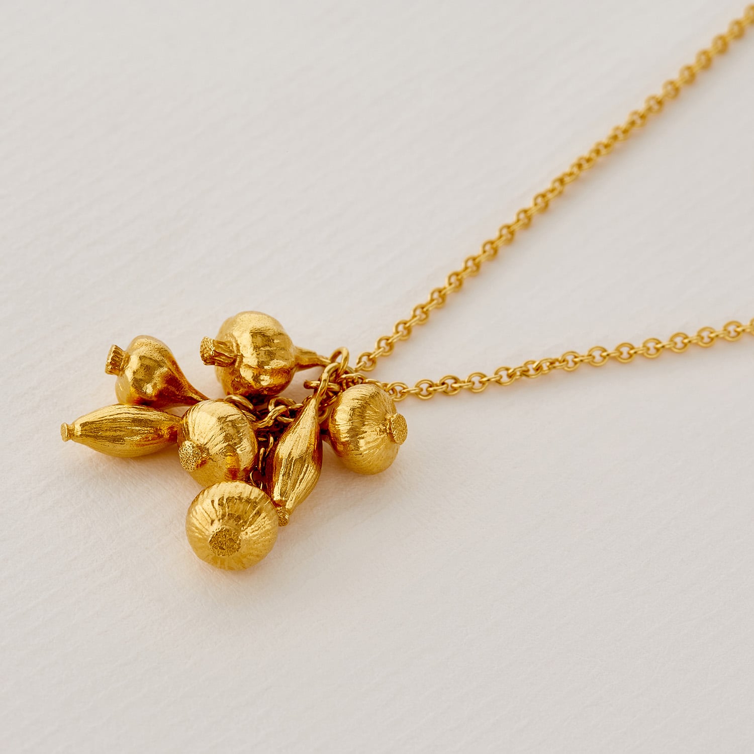 paper shot of gold plated Know Your Onions Cluster Necklace by Alex Monroe Jewellery