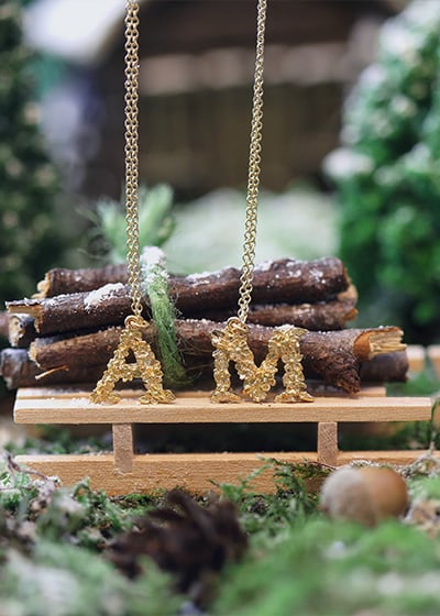 A & M floral Alex Monroe Letters balancing on a wooden slegh