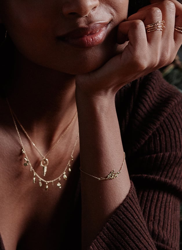 Model wearing a Inline Wheatsheaf Bracelet from Golden Harvest by Alex Monroe Jewellery