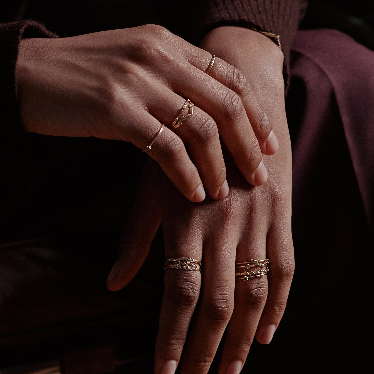 Model wear a selection of beautiful handmade elegant 18ct solid gold stacking rings by Alex Monroe fine Jewellery