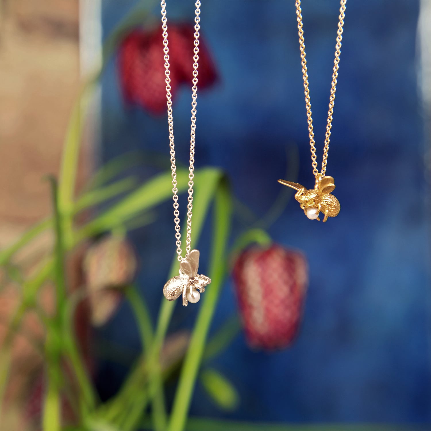 flying bee with pearl necklace