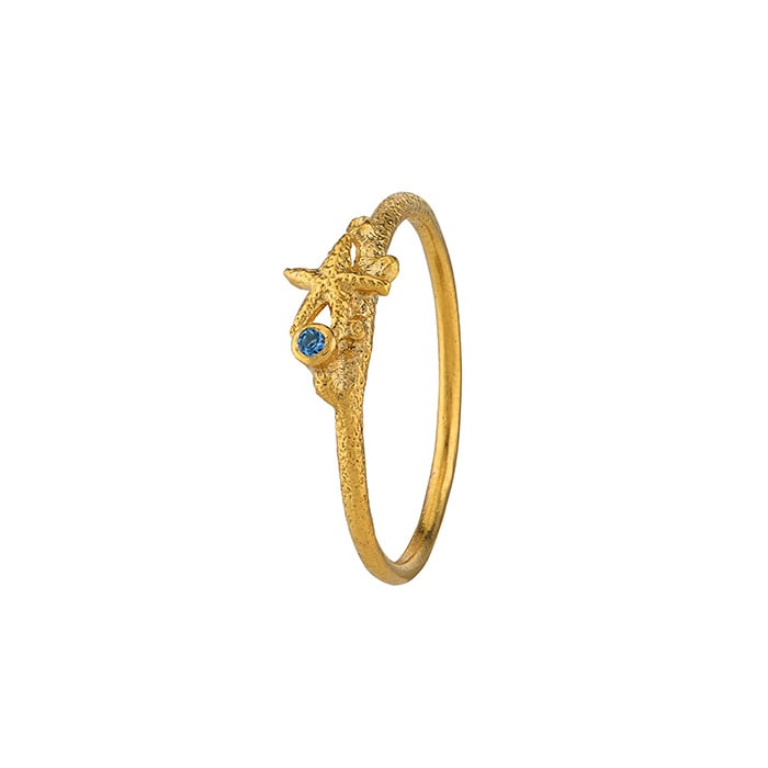 Product shot of gold plated Starfish Stacking Ring with Aquamarine by Alex Monroe Jewellery