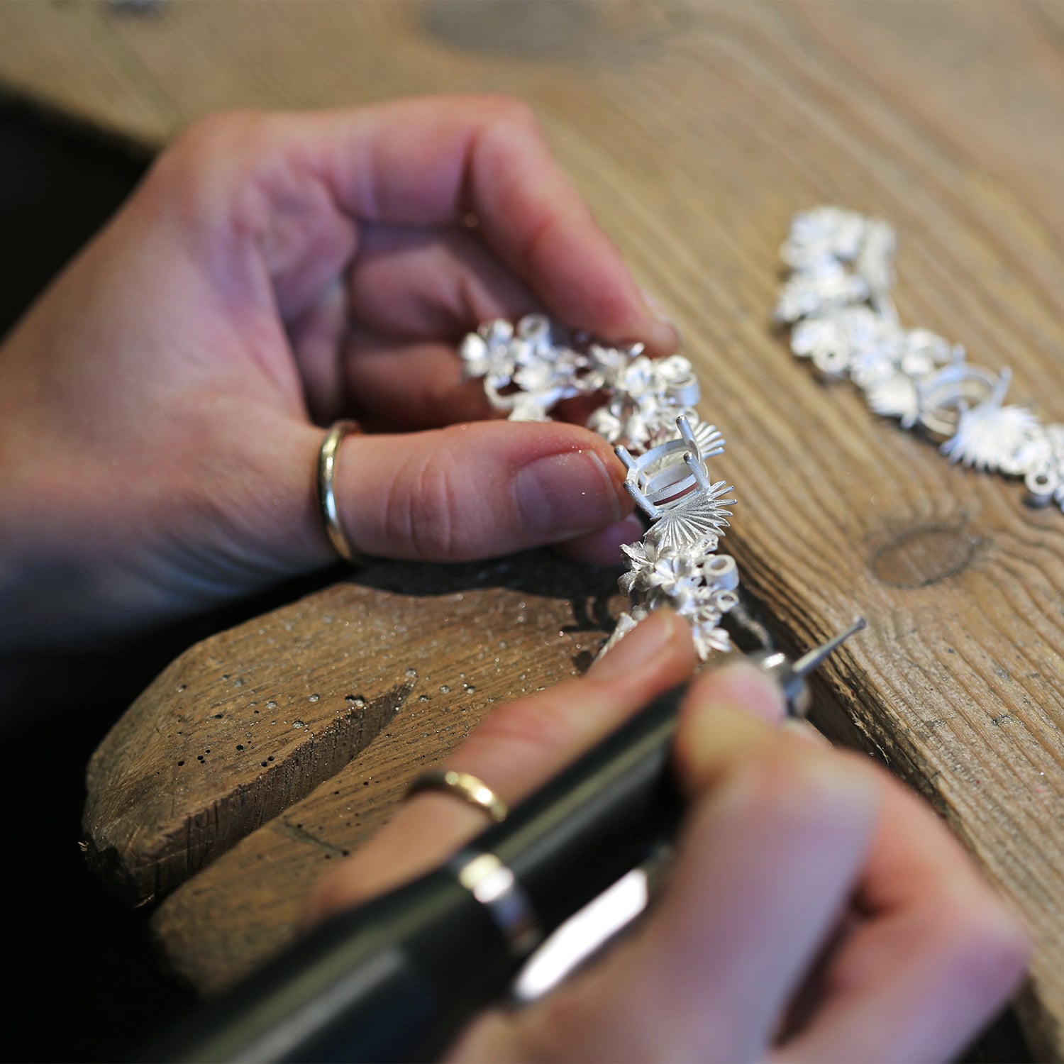 making a large silver statement necklace at the jewellery bench