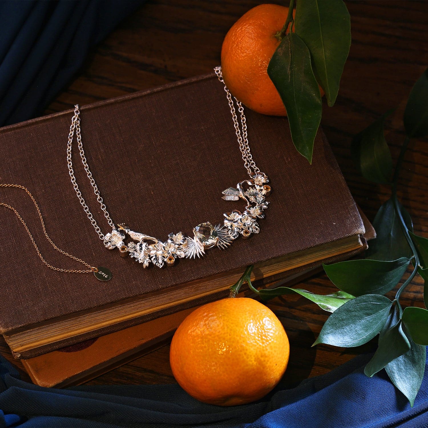 Island Queen Necklace set with Green Amethyst & Citrines featuring hummingbird, cockatoo and jungle foliage