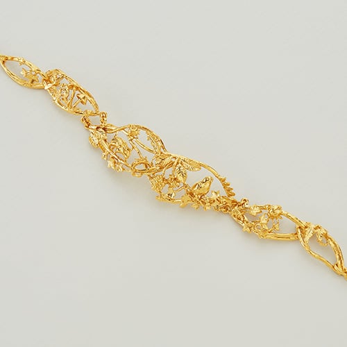 paper shot of a gold plated Enchanted Winter Woodland Marquise Link Bracelet by Alex Monroe Jewellery