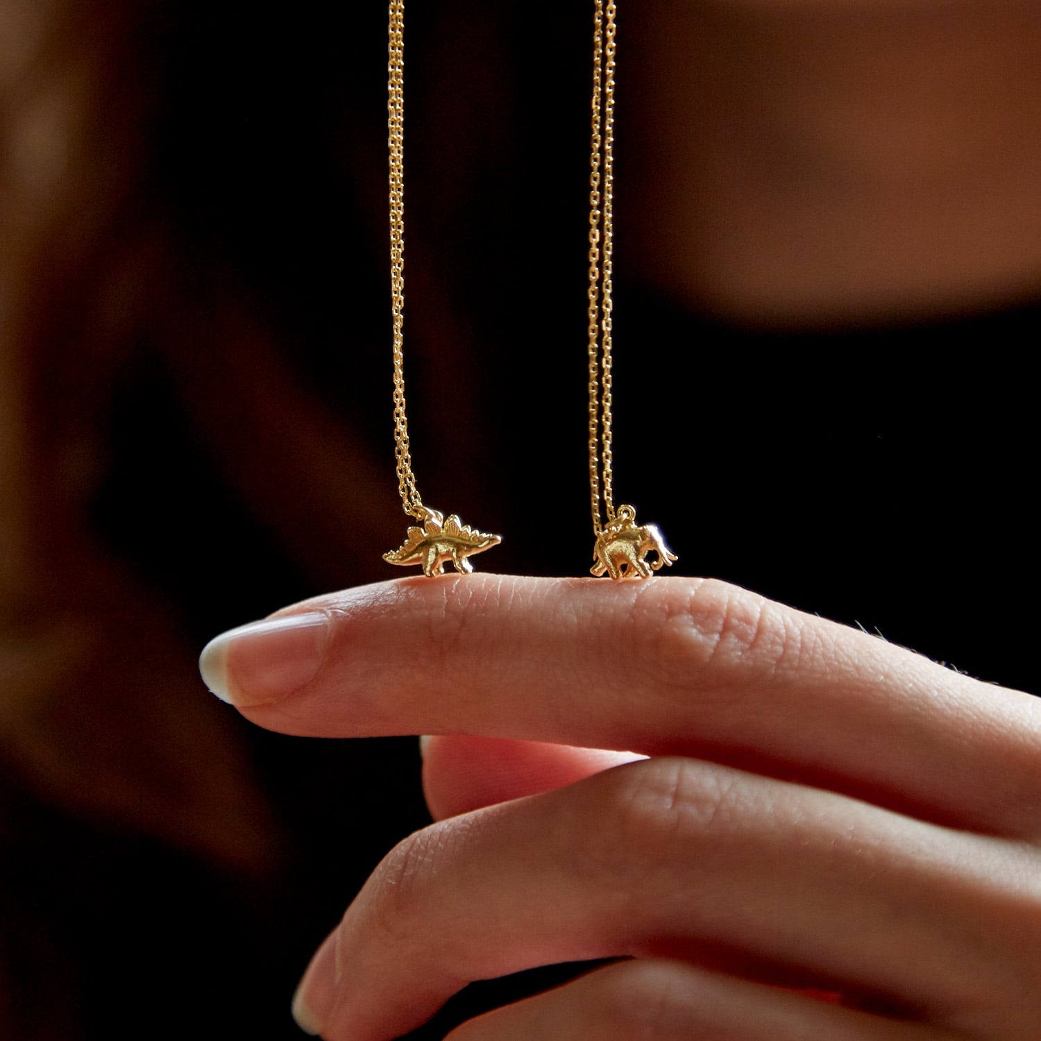 alex monroe fine jewellery teeny tiny stegosaurus and elephant necklace