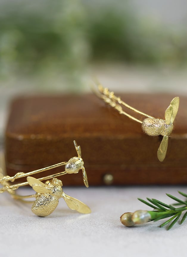 Model wearing gold plated Set of 3 Mixed Size Bee Hair Pins by Alex Monroe Jewellery