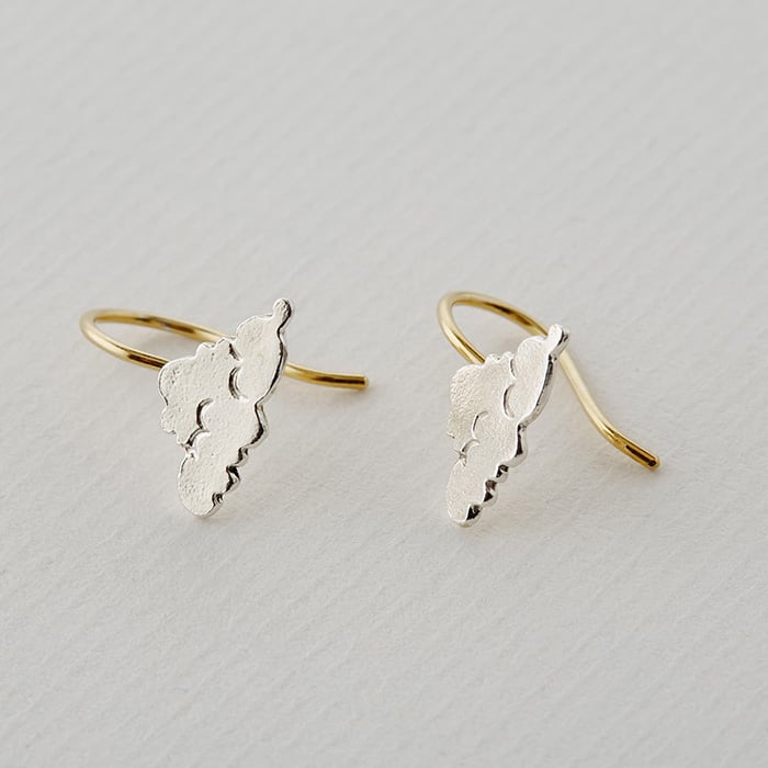 Paper shot of mixed metal Little Cloud Hook Earrings by Alex Monroe Jewellery