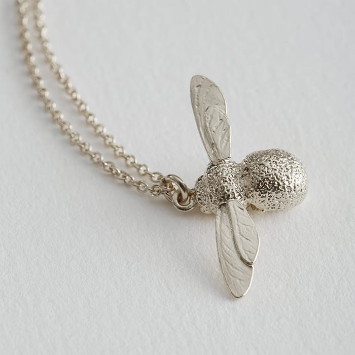 paper shot of silver Baby Bee Necklace by Alex Monroe Jewellery