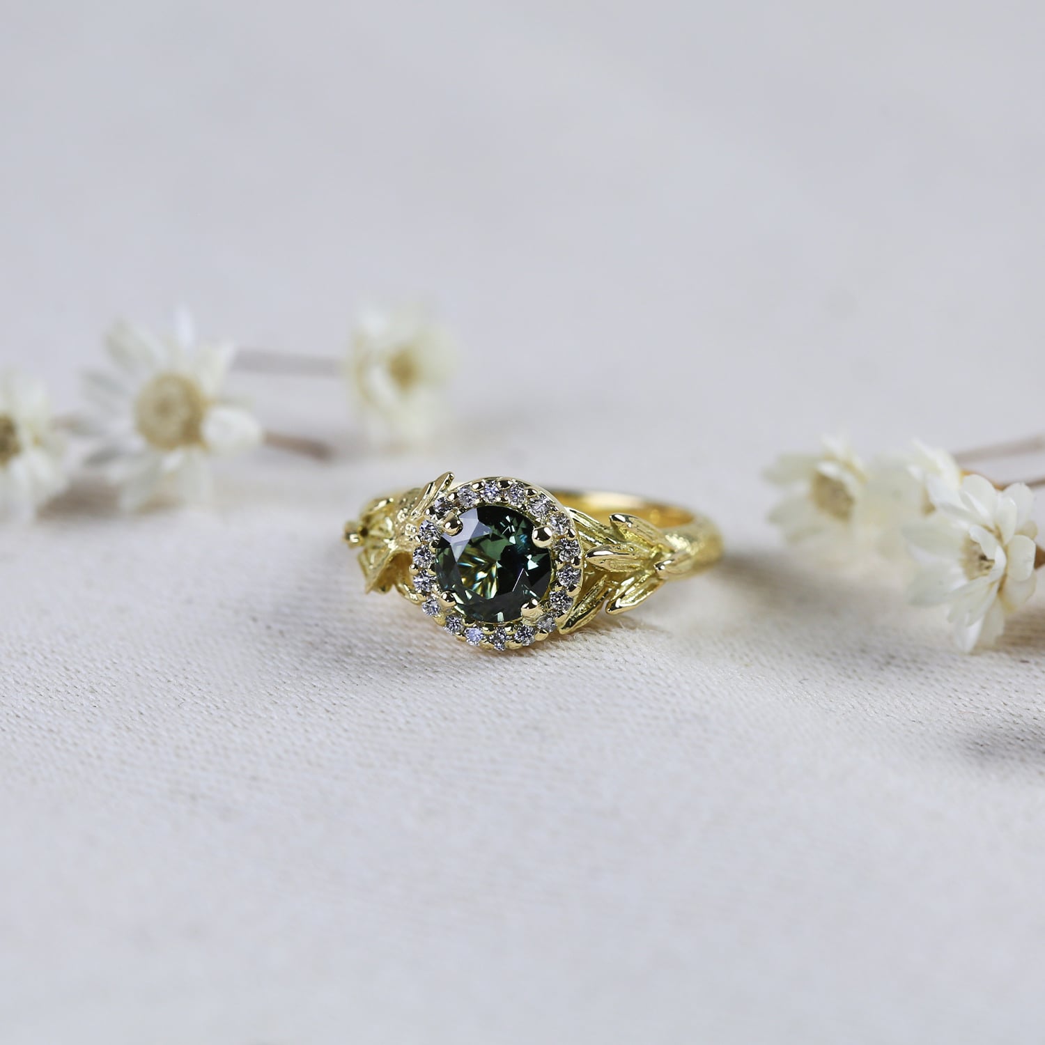 one of a kind ring with green sapphire and diamonds