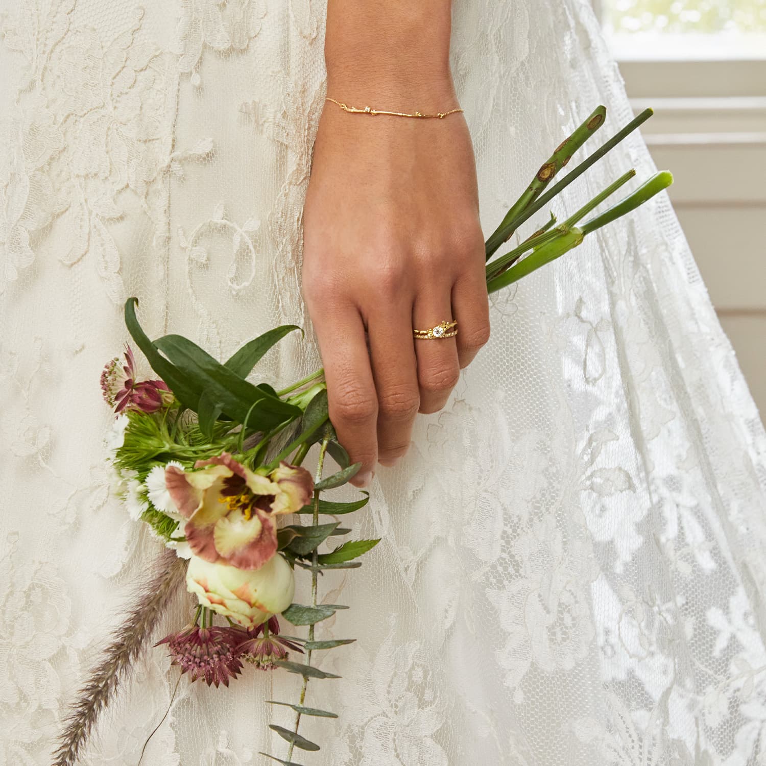 model wearing silver gold plated rings by alex monroe