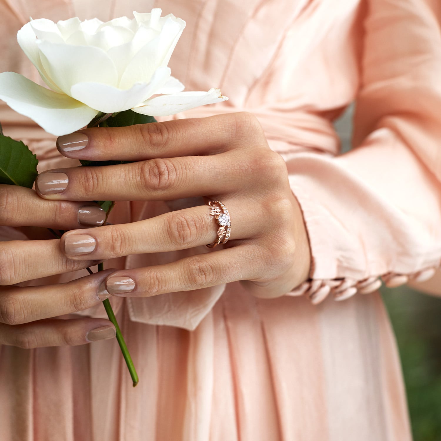 Model wearing rose gold Beekeeper Ring with 0.25ct Oval Diamond by Alex Monroe Jewellery