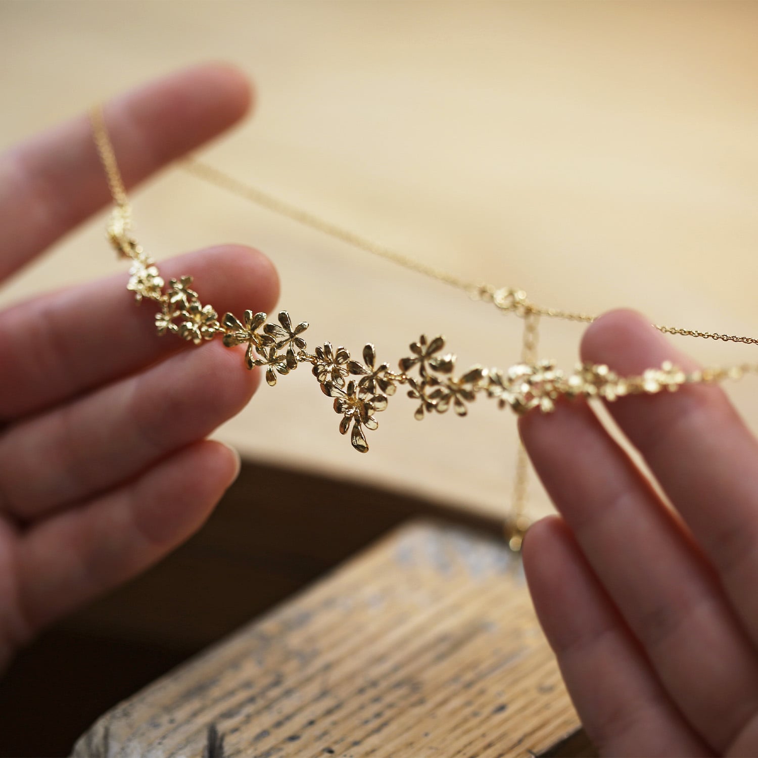 Gold plated Clustered Rosette Flourish Collar Necklace being worked on in Alex Monroes workshop