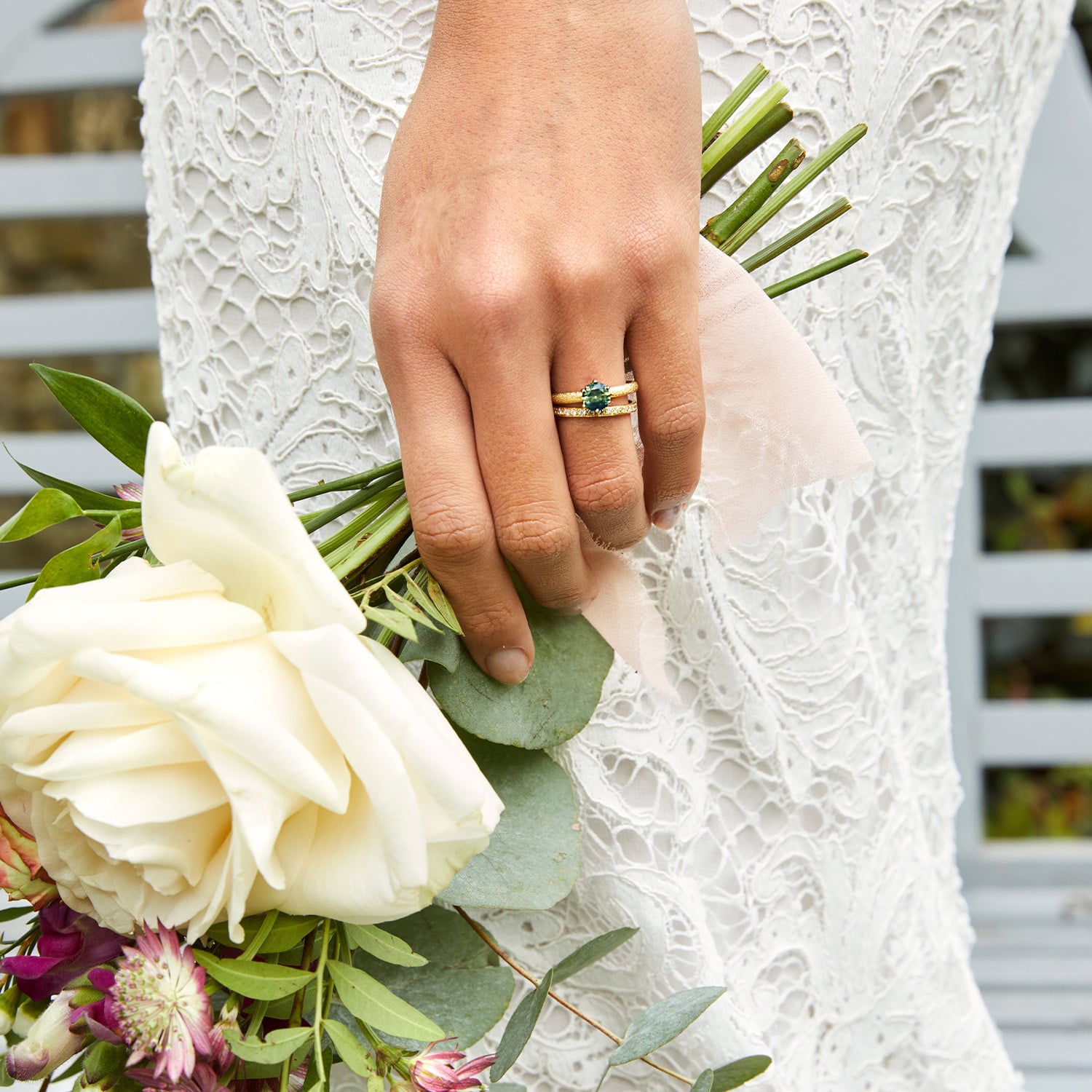 model wearing wedding ring and hair accessory by alex monroe