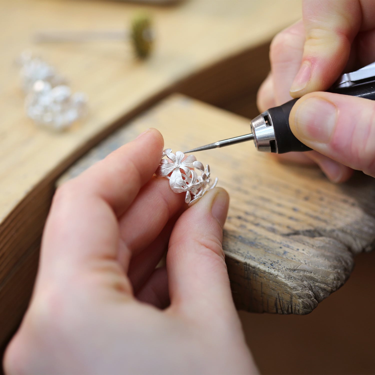 Silver Large Rosette Prosper Hoops earrings getting made in alex monroes workshop