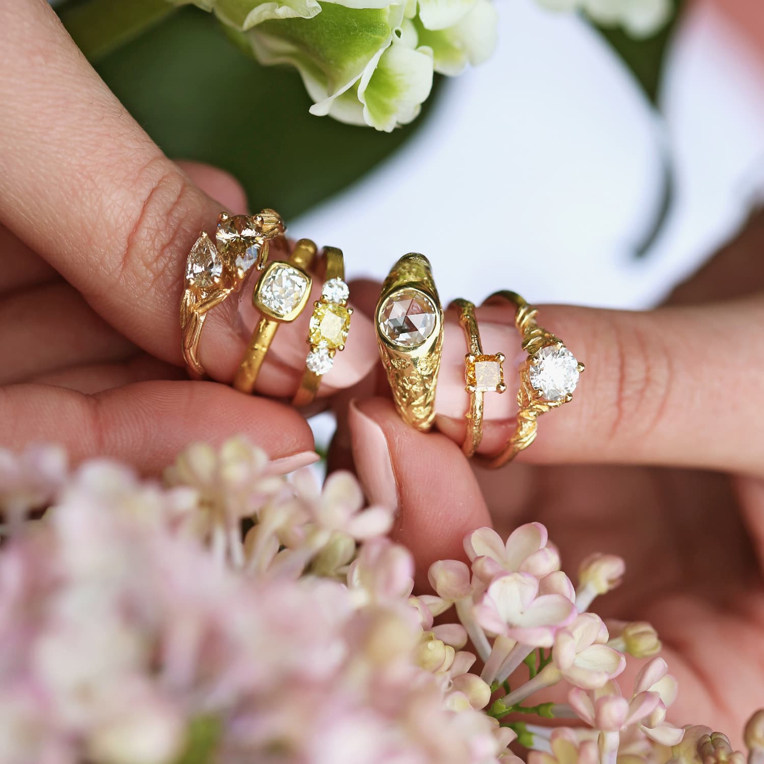 bespoke set up with green gemstones and ring