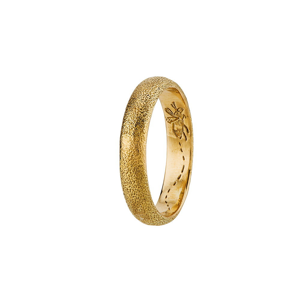Product shot of yellow gold 4mm Bee Texture Band with Hidden Engraving by Alex Monroe Jewelley